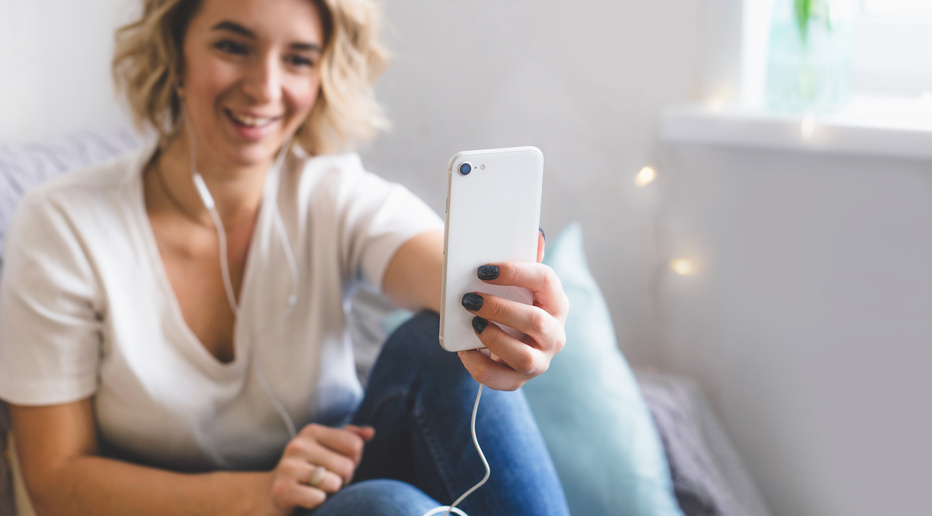 Woman Video Chatting with Her Family Using Her Phone